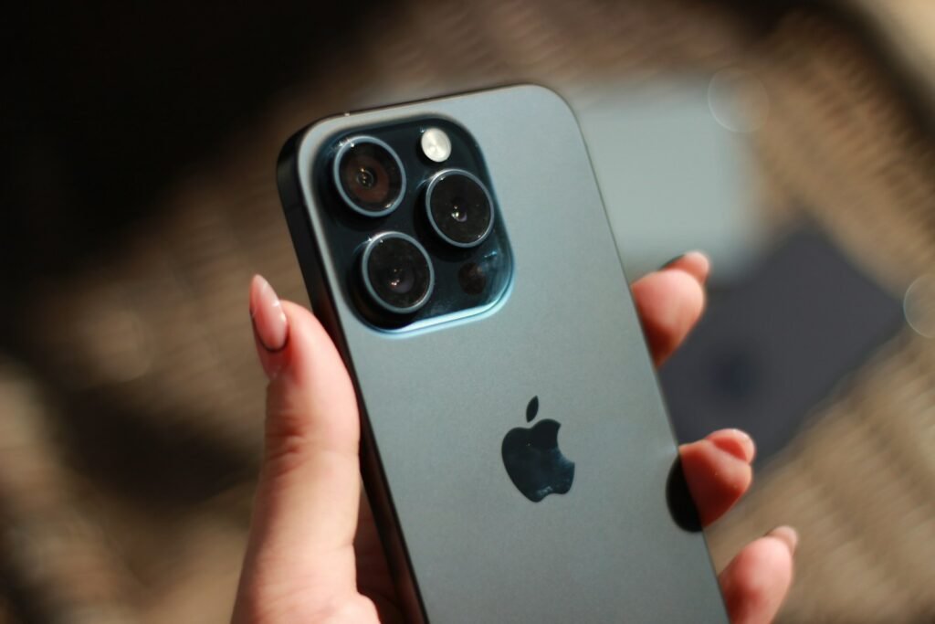 a close up of a person holding a cell phone